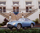 AUT 06 RK0002 01
1962 Aston Martin Zagato DB4 GT Blue 3/4 Front View In Front Of Lodge