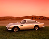 AUT 06 RK0012 04
1964 Aston Martin DB5 Silver Side 3/4 View On Grass By Hills Filtered
