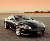 AUT 06 RK0059 03
2005 Aston Martin DB9 Coupe Black 3/4 Front View On Pavement Filtered