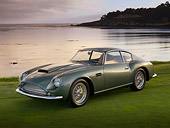 AUT 06 RK0093 01
1961 Aston Martin DB4 GT Zagato Green 3/4 Front View On Grass By Water Trees
