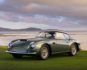 AUT 06 RK0094 01
1961 Aston Martin DB4 GT Zagato Green 3/4 Front View On Grass By Water Hills