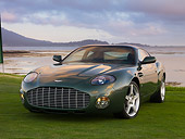 AUT 06 RK0099 01
2003 Aston Martin DB7 Zagato Green 3/4 Front View On Grass By Water Sky