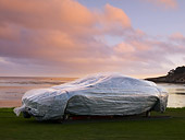 AUT 06 RK0101 01
Covered Wood Model Of Aston Martin DB7 Zagato 3/4 Front View On Grass By Water Trees Sky