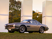 AUT 06 RK0105 01
1961 Aston Martin DB4 GT Bertone Jet Green 3/4 Front View On Grass By Columns Trees