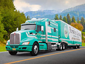 AUT 07 RK0062 01
2008 Kenworth T-660 Custom Green And White 3/4 Front View On Road By Trees