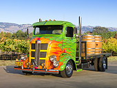 AUT 07 RK0064 01
1938 GMC COE Flatbed Truck Green With Flames 3/4 Front View On Pavement By Farm