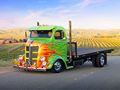 AUT 07 RK0066 01
1938 GMC COE Flatbed Truck Green With Flames 3/4 Front View On Road By Vineyard
