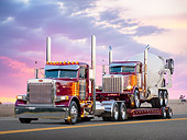 AUT 07 RK0079 01
2000 Peterbilt 379 And 2001 Peterbilt 357 Mixer Dark Rose Metallic 3/4 Front View On Road At Sunset