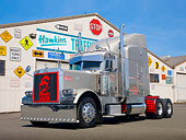 AUT 07 RK0125 01
2006 Peterbilt 379 Semi Metallic Sand 3/4 Front View On Pavement By Traffic Sign Store