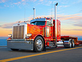 AUT 07 RK0152 01
2005 Peterbilt 379 EXHD Red With Flames 3/4 Front View On Road At Dusk