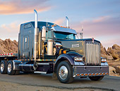 AUT 07 RK0157 01
1997 Kenworth W900 Black 3/4 Front View On Pavement By Rocks