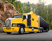 AUT 07 RK0166 01
2001 Kenworth T-600 Orange With Black 3/4 Front View On Pavement In Mountains