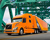 AUT 07 RK0176 01
2006 Volvo 64T Big Rig Orange 3/4 Front View On Bridge