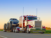 AUT 07 RK0190 01
1999 Peterbilt 379 Red, White And Blue And 2011 Dodge Ram Monster Truck Black With Blue Flames On Road