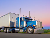 AUT 07 RK0196 01
2006 Peterbilt 379 Blue With Flames 3/4 Front View On Pavement At Dusk