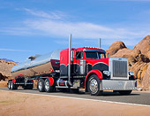 AUT 07 RK0202 01
1992 Peterbilt Red And Black Scalloped With Trailer 3/4 Front View On Road In Desert