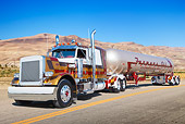 AUT 07 RK0238 01
1982 Peterbilt 359 Red, Gold And Brown 3/4 Front View On Road By Hills