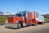 AUT 07 RK0243 01
1991 Mack Superliner Burnt Orange 3/4 Front View On Road By Lake And Mountains