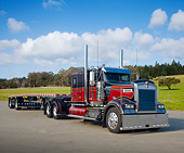 AUT 07 RK0258 01
2007 Kenworth W900L With Trailer Black And Red 3/4 Front View On Pavement