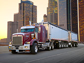 AUT 07 RK0262 01
2007 Kenworth T800 With Double Trailer Burgundy 3/4 Front View On Road By Skyscrapers