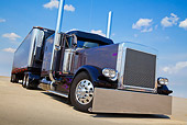 AUT 07 RK0283 01
2002 Peterbilt 379 Gray With Black Fenders And Trailer 3/4 Front View On Pavement