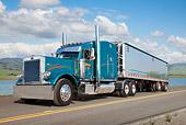 AUT 07 RK0300 01
1997 Peterbilt 379 Blue-Green 3/4 Front View On Road By Water