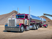 AUT 07 RK0332 01
2005 Peterbilt 379X Grape And Mocha 3/4 Front View By Piles Of Dirt