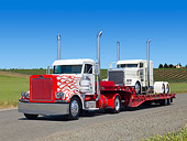 AUT 07 RK0363 01
1988 Peterbilt 379 Red And White With 1988 Peterbilt 379 White And Purple On Trailer 3/4 Front View On Pavement By Vineyard