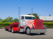 AUT 07 RK0365 01
1988 Peterbilt 379 Red And White 3/4 Front View On Pavement By Shrubs