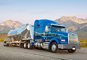 AUT 07 RK0384 01
2013 Western Star 4900 SB Blue 3/4 Front View On Road By Mountains