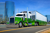AUT 07 RK0387 01
2000 Kenworth W900 Green And White 3/4 Front View On Road By Glass Buildings
