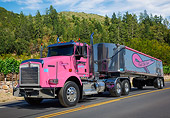 AUT 07 RK0389 01
2013 Kenworth 7800 Pink 3/4 Front View On Road By Vineyard