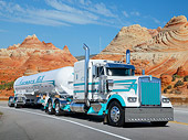 AUT 07 RK0391 01
2013 Kenworth W9L White And Teal 3/4 Front View On Road By Red Rock