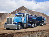 AUT 07 RK0396 01
2007 Peterbilt Class 379 Blue 3/4 Front View On Dirt By Dirt Piles