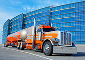 AUT 07 RK0399 01
2012 Peterbilt 389 Tanker Orange And Gold 3/4 Front View On Pavement By Glass Building