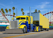 AUT 07 RK0401 01
2013 Peterbilt 389 Yellow And Blue 3/4 Front View On Road By Roller Coaster