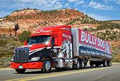 AUT 07 RK0402 01
2013 Peterbilt 579 Bully Dog Red 3/4 Front View On Road By Red Rock