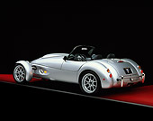 AUT 08 RK0008 07
1999 Panoz AIV Roadster Silver 3/4 Rear View On Red Floor Gray Line Studio