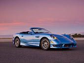 AUT 08 RK0050 01
2006 Panoz Esperante GT Convertible Blue Low 3/4 Side View On Pavement