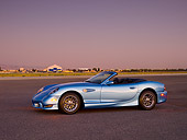 AUT 08 RK0051 01
2006 Panoz Esperante GT Convertible Blue 3/4 Side View On Pavement