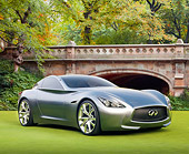 AUT 09 BK0019 01
Infiniti Essence Concept Silver 3/4 Front View On Grass By Bridge And Trees
