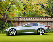 AUT 09 BK0020 01
Infiniti Essence Concept Silver Profile View On Grass By Wall And Trees