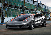 AUT 09 BK0032 01
Bertone Nuccio Concept Gray And Red 3/4 Front View On Pavement By Old Factory Building