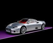AUT 09 RK0832 03
2006 Spyker C8 Double 12 S Silver 3/4 Front View On Purple Floor Studio
