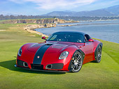 AUT 09 RK1148 01
2010 Devon GTX Concept Red And Black 3/4 Front View On Grass By Ocean