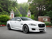 AUT 09 RK1203 01
Jaguar XJ 70 Concept White 3/4 Front View On Pavement By Trees And Gate