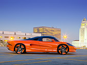 AUT 09 RK1230 01
2011 Vision SZR Concept Orange Profile View On Pavement By Buildings At Dusk
