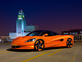 AUT 09 RK1231 01
2011 Vision SZR Concept Orange 3/4 Front View On Pavement By Buildings At Night
