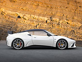 AUT 09 RK1269 01
Lotus Evora GTE Roadcar Concept Silver With Black Stripe Profile View On Pavement By Rock Wall