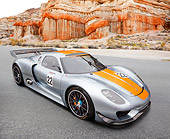 AUT 09 RK1270 01
Porsche 918 RSR Concept Silver With Orange Stripe 3/4 Front View On Pavement By Red Rock